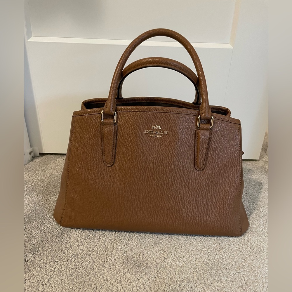 Brown sturdy leather Coach purse